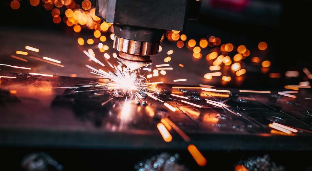 Close-up of a laser cutter sparking